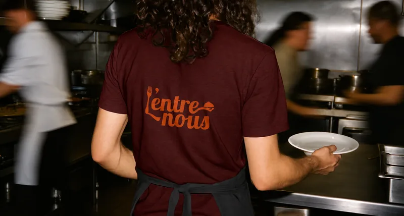 L’Entre Nous — restaurant staff wearing the branded t-shirt
